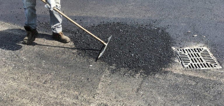 Surface being prepared and worked by hand before a protective coat