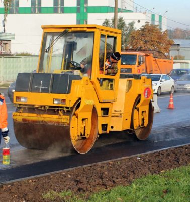 Workers paving asphalt - Turnkey Asphalt