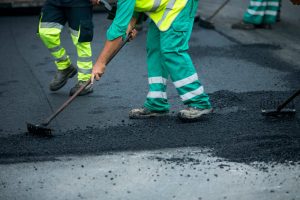 asphalt paver workers