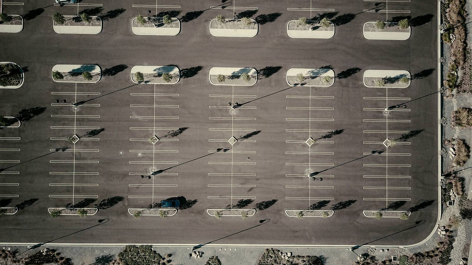 A parking lot with fresh line striping seen from above