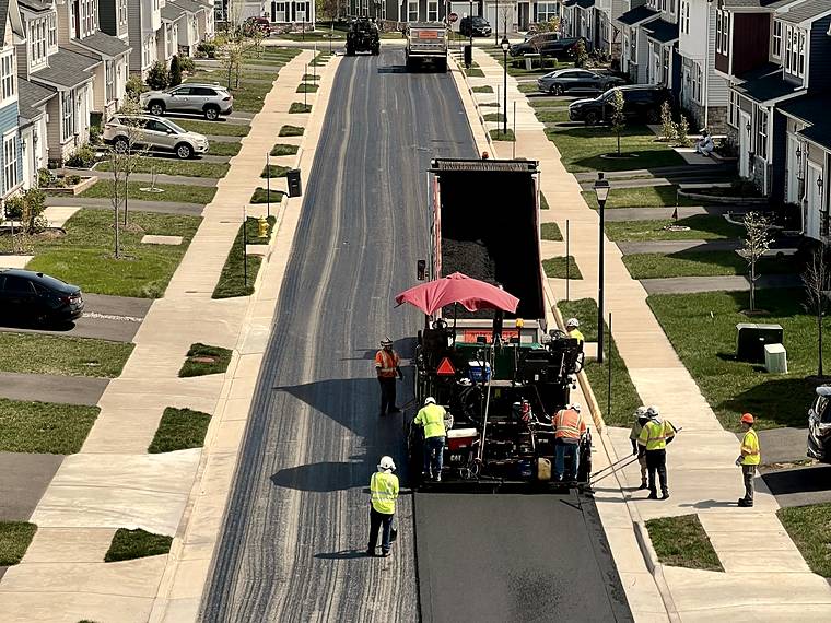 Old asphalt being replaced on a residential street