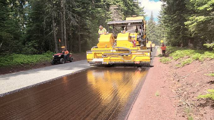 A paving machine laying a new residential surface